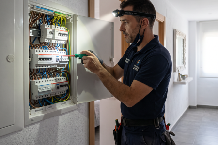 Professional electrician working in a residential property