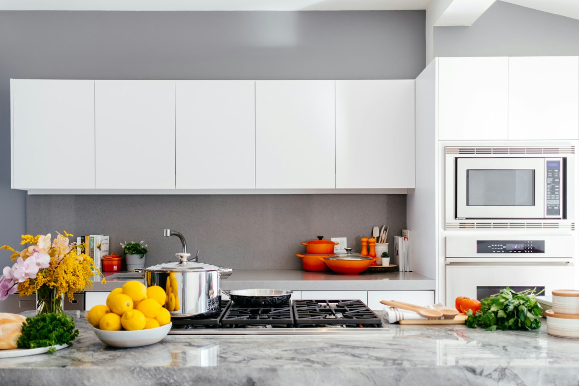 Bright kitchen with white cabinetry and a central island