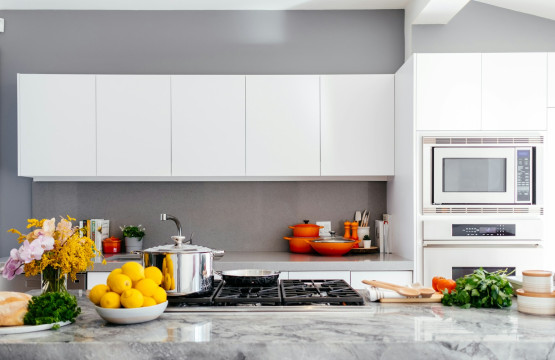 Bright kitchen with white cabinetry and a central island