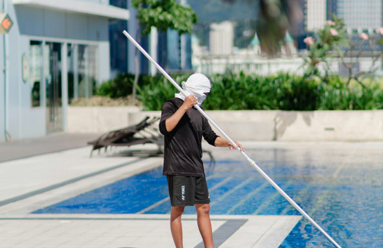 Professional pool maintenance at a residential property